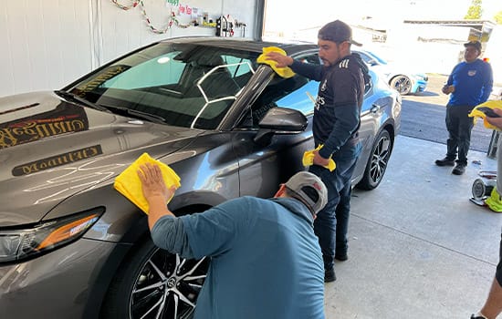 team-auto-detailing-riverside-ca-hands-on-polish Team Member Polishing a car -Mobile Auto Detailing
